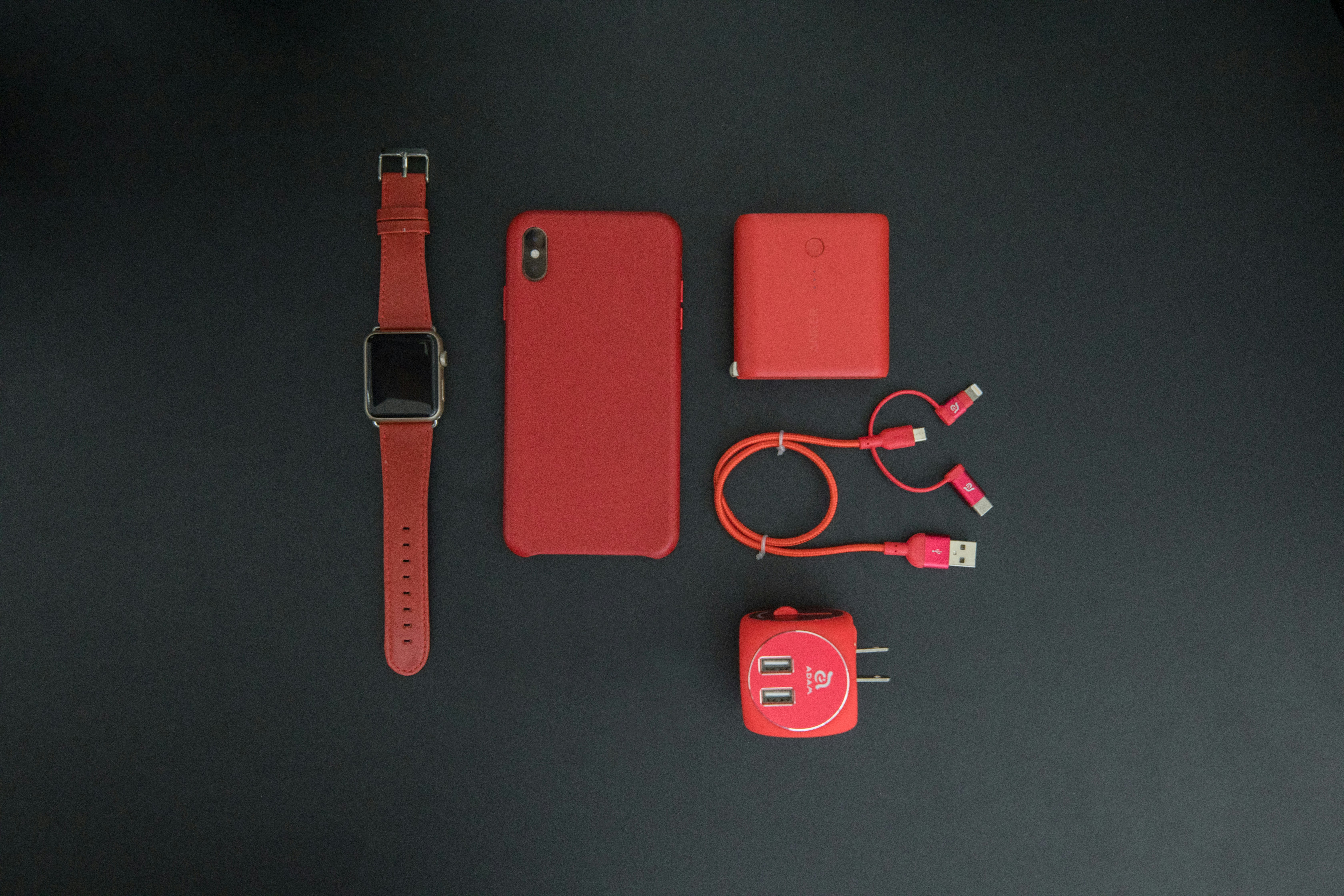 Phone accessories arranged on a dark background